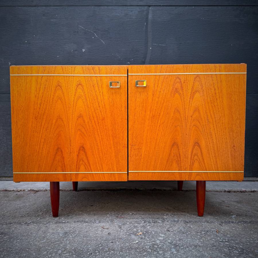 Danish modern teak compact credenza with gold accents — photograph 2 of 6