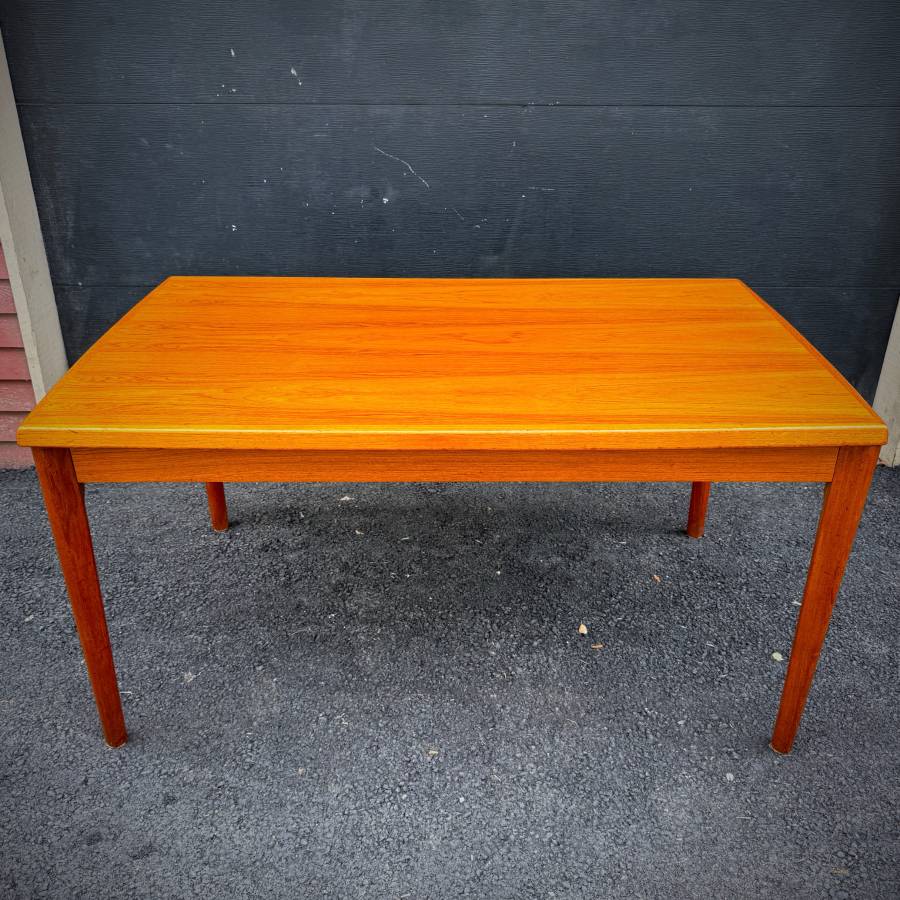 Danish modern vintage teak surfboard dining table with extensions — photograph 2 of 9