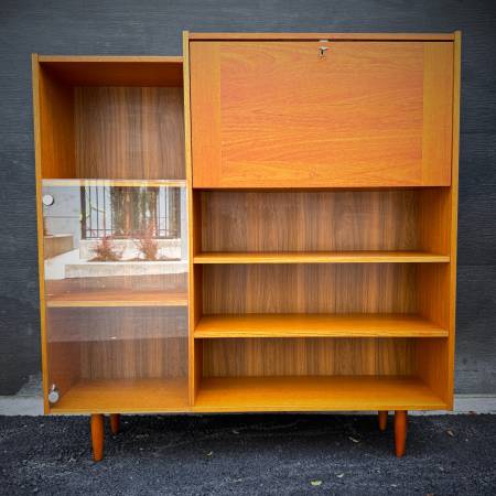 Mid century modern teak and glass shelving unit with drop down bar