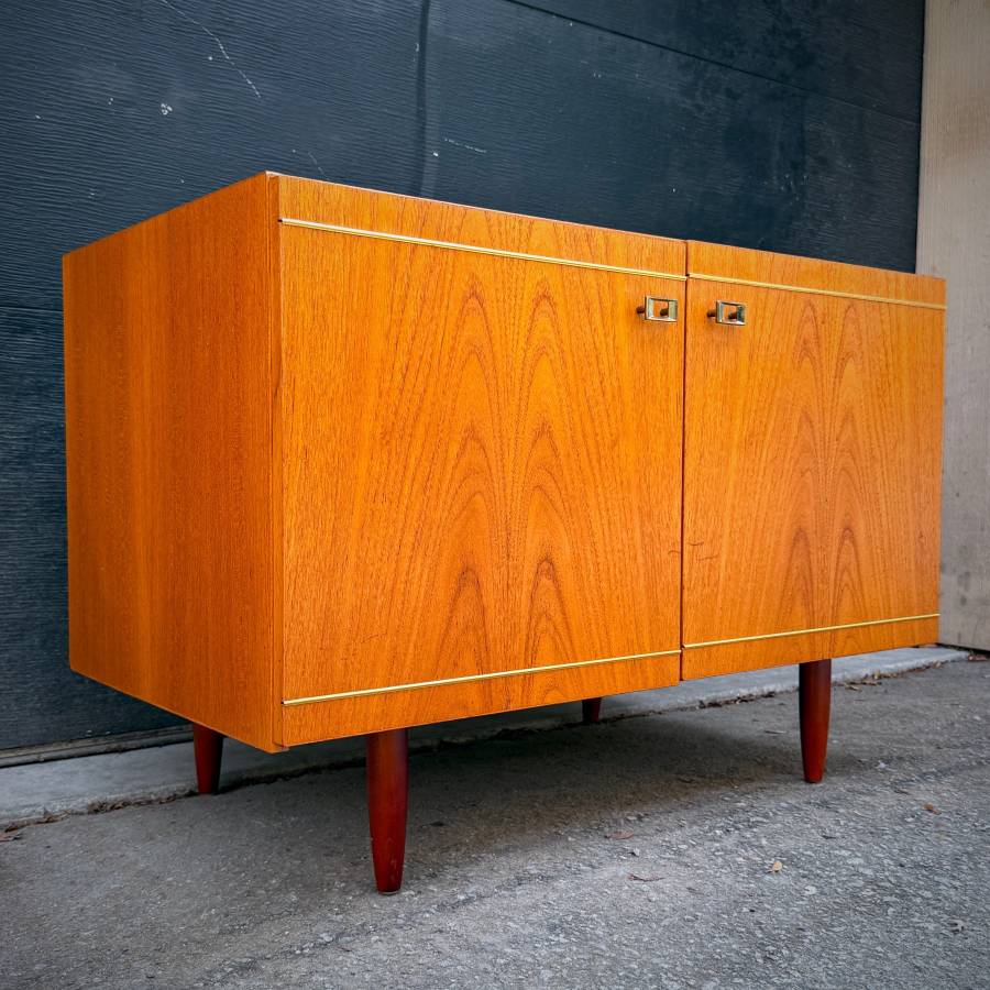Danish modern teak compact credenza with gold accents — photograph 3 of 6