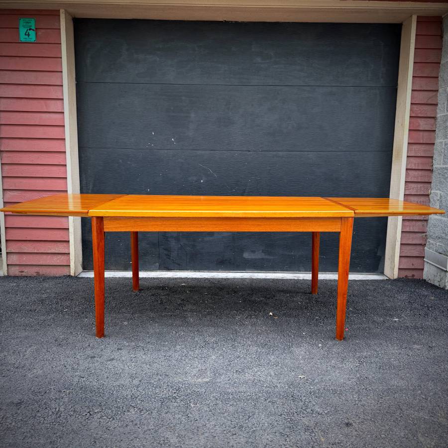 Danish modern vintage teak surfboard dining table with extensions — photograph 7 of 9