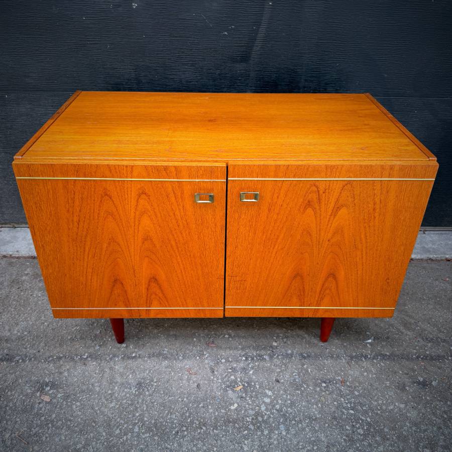 Danish modern teak compact credenza with gold accents — photograph 4 of 6