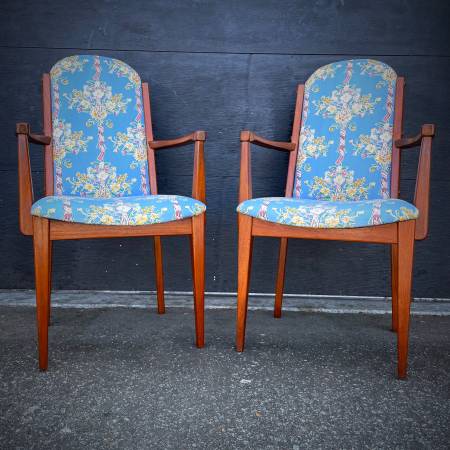 Pair of mid century modern teak arm chairs
